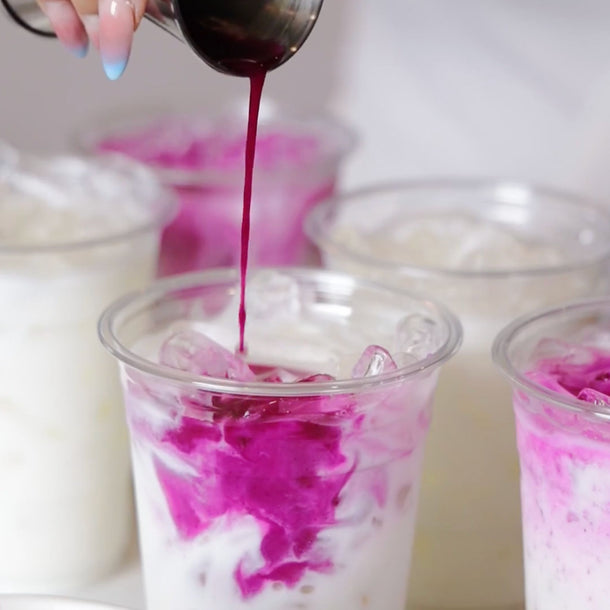 Video of Pink and Blue Matcha being poured into ice lattes